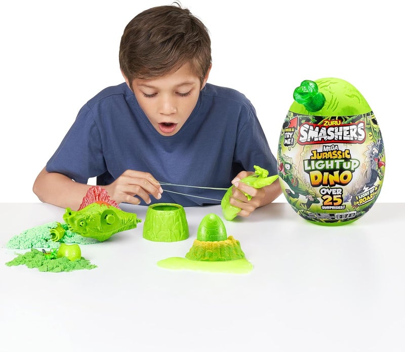 SMASHERS حزمة سمشرز ميغا دينو كومبو مع بيضة جزيرة الديناصورات وبيضة جراسيك المضيئة، أكثر من 25 مفاجأة، شخصيات ديناصور، سلايم، رمل، رغوة، بيض مصغر، ألعاب قابلة للجمع للأطفال لتحطيمها وبنائها - Image 3